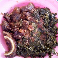 A picture of Beef stew and kales.
