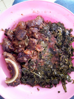 A picture of Beef stew and kales.
