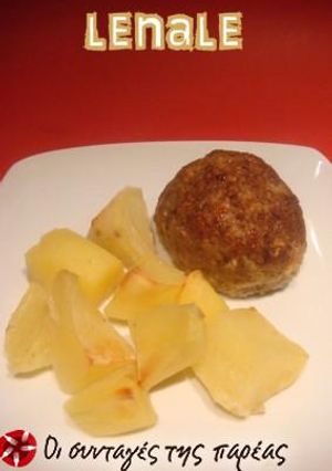 A picture of Mini meatloaves with potatoes in the oven.