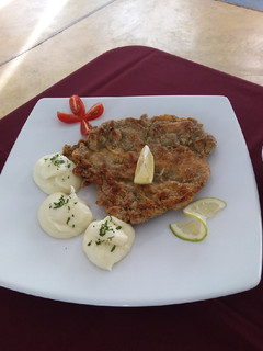 Una foto de Milanesa con Puré de Papas