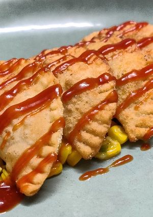 A picture of Corn and cheese empanadas.