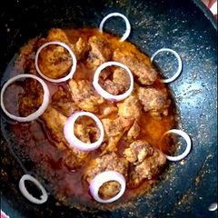 A picture of Chicken masala karahi.
