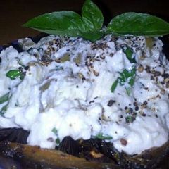 A picture of Sig's Two Cheese Spread, Basil, Garlic and Olives.