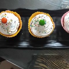 A picture of Fruit pudding in mango strawberry chocolates cup.