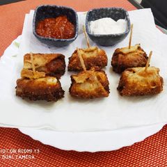 A picture of Chicken salami roll ups.