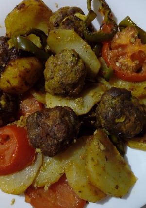 A picture of Baked Kefta with Potatoes and Vegetables.