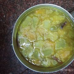 A picture of Yellow daal with bottle gourd and pumpkin.