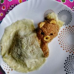 A picture of Sleeping Rice Bear with an Egg Blanket.
