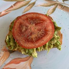 A picture of Avocado Toast w/ Tomato.
