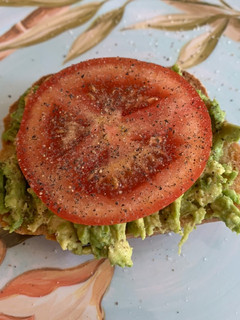 A picture of Avocado Toast w/ Tomato.