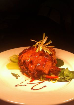 A picture of Confit Duck With Tai Noodle And Pac Choi.