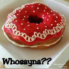 A picture of Whosayna’s Donuts filled with Custard Creame.
