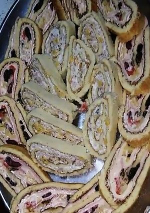 Una foto de Pionono agridulce y de palmitos
