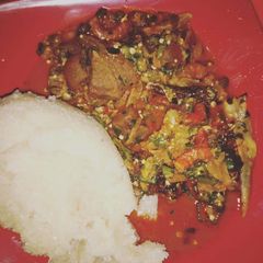 A picture of Okro soup with white garri.