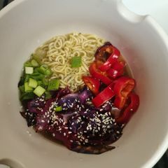 A picture of Vegetable broth with noodles and vegetables (Vegetable Ramen Bowl).