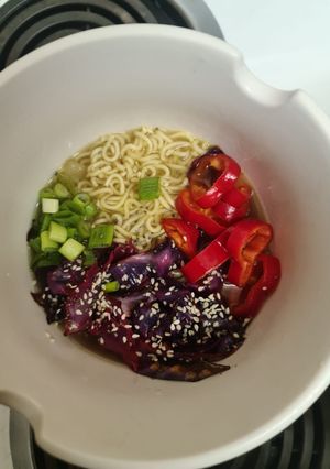 A picture of Vegetable broth with noodles and vegetables (Vegetable Ramen Bowl).