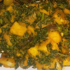 A picture of Porridge  yam with  vegetables.