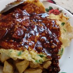 A picture of Fried Tofu and Egg w/ Peanut Sauce (Tahu Tek).