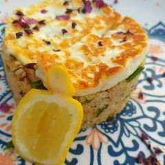 A picture of Squeaky cheese and herbed couscous.