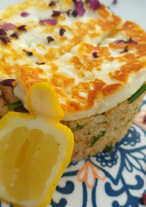 A picture of Squeaky cheese and herbed couscous.