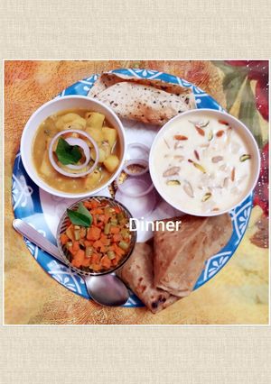 A picture of Potato gravy, kheer, beans and carrots dry bhaji paratha and papad.