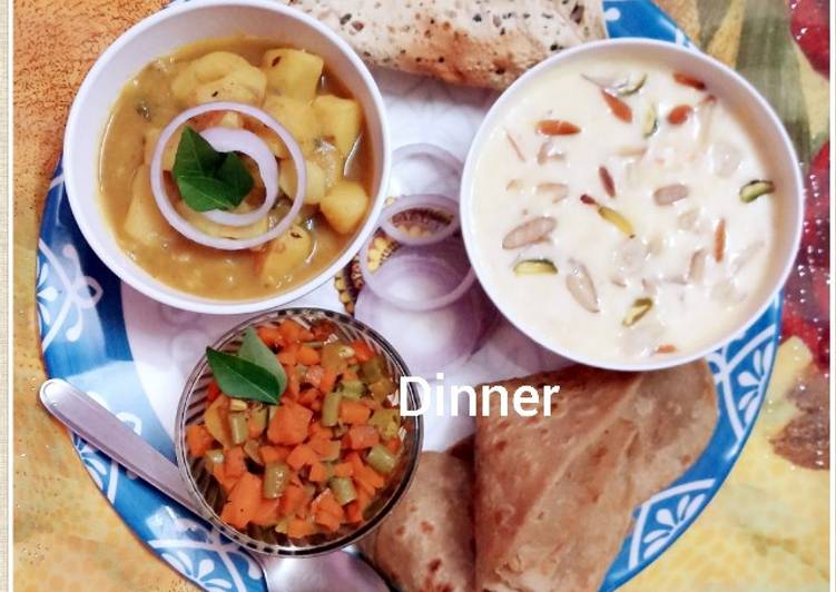 Potato gravy, kheer, beans and carrots dry bhaji paratha and papad