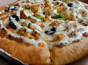A picture of creamy tikka pizza