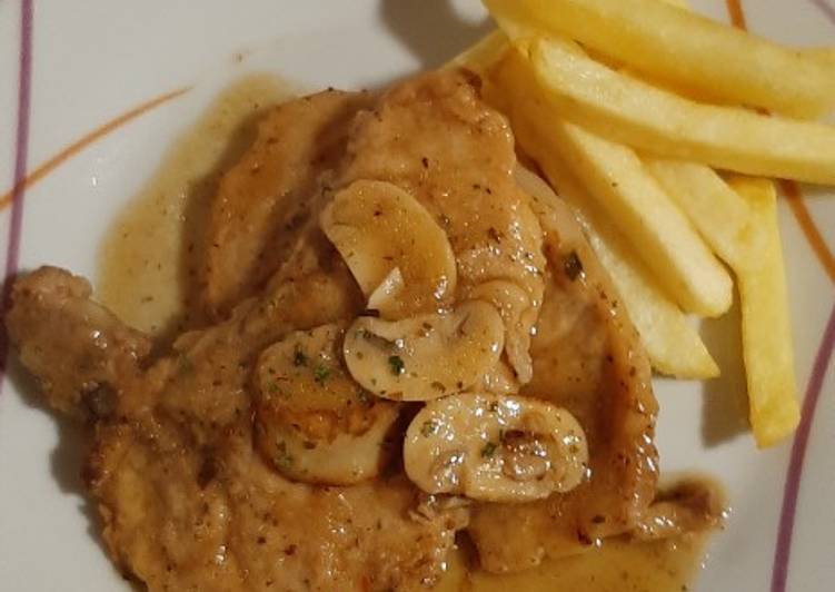 Chuletas de cerdo con champiñones y cerveza