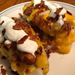 A picture of Hot dogs with baked potato buns.