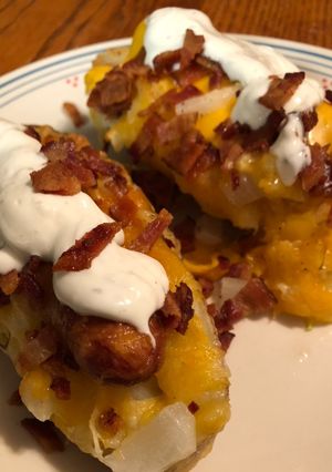 A picture of Hot dogs with baked potato buns.