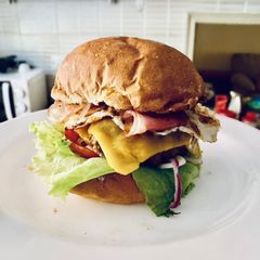 A picture of Bacon, egg, and cheese breakfast burger.
