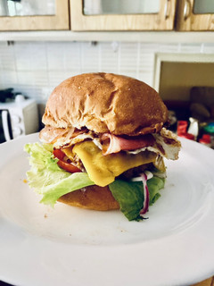 A picture of Bacon, egg, and cheese breakfast burger.