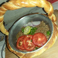 A picture of Qeema do payaza In Baked Basket.