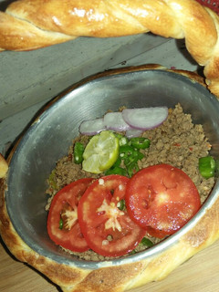 A picture of Qeema do payaza In Baked Basket.