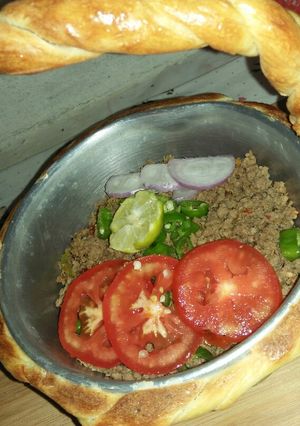 A picture of Qeema do payaza In Baked Basket.