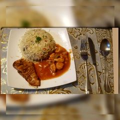 A picture of Egg fries rice with chicken shashlik and grilled chicken.