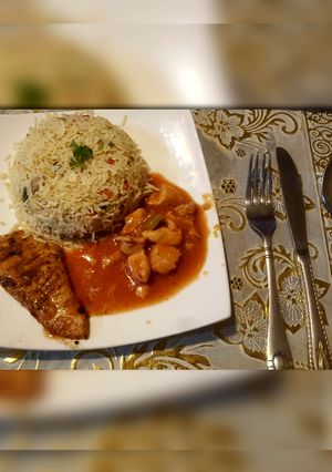 A picture of Egg fries rice with chicken shashlik and grilled chicken.