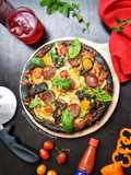 Black Pizza With Beef, Pepperoni, and Veggie