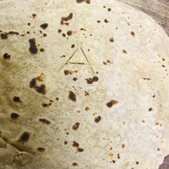 A picture of The regular chapati make it eye catching for your kids adding alphabets to it...!!.