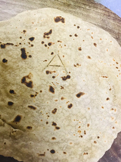 A picture of The regular chapati make it eye catching for your kids adding alphabets to it...!!.