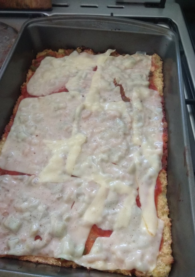 Una foto de Pizza con masa de coliflor