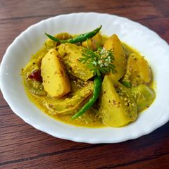 A picture of BENGALI STYLE TANGY GREEN TOMATO CURRY WITH MUSTARD SAUCE /KANCHA TOMATOR SORSHE JHAL.