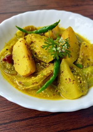 A picture of BENGALI STYLE TANGY GREEN TOMATO CURRY WITH MUSTARD SAUCE /KANCHA TOMATOR SORSHE JHAL.