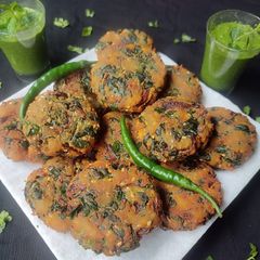 A picture of Crispy Methi Vada & Green Chutney.