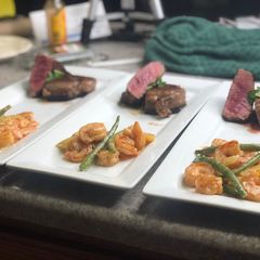 A picture of Fillet Mignon w/ Kicker Shrimp Scalloped Baby Potatoes.