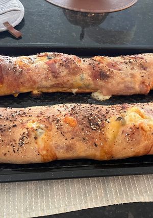 A picture of Layered Meat and Cheese Stromboli.