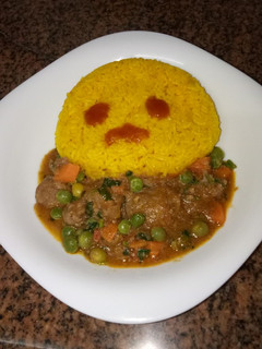 A picture of Tumeric rice and goat stew # author marathon.