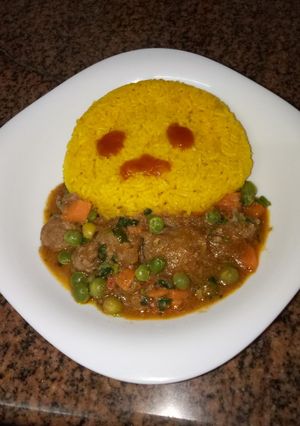 A picture of Tumeric rice and goat stew # author marathon.