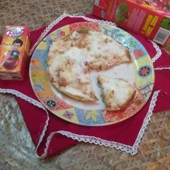 A picture of Egg pudding with Apple juice and Cranberry juice.
