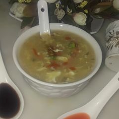 A picture of Vegetable corn soup.